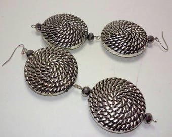 Silver tone dangling earrings