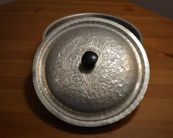 Vintage World hand forged aluminum bowl with embossed floral design & black knobbed lid