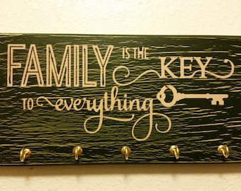 Green "Family is the key to everything" key hanger sign