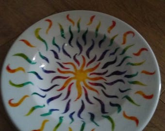 A hand painted white ceramic bowl