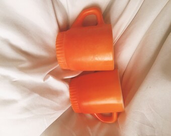 Set of two orange anchor hocking oven proof coffee mugs