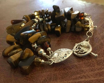 Triple strand pearl and tiger eye bracelet