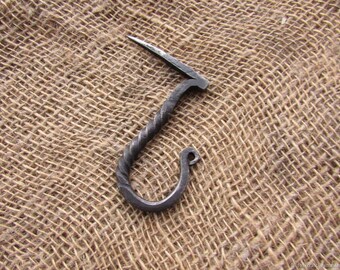 Hand forged hook. Wall hook. Coat hook. Black Iron Hook. To hammer a hook.