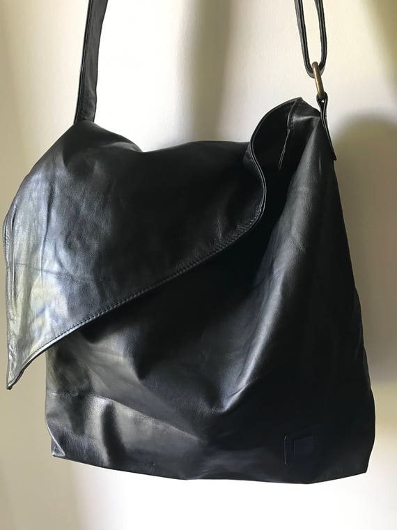 Genuine soft slouchy leather cross body bag. Unique folding