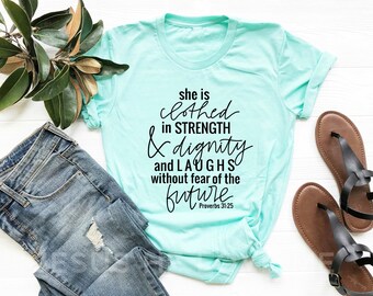 Christian T-shirts She is clothed in strength & dignity and laughs without fear of the future proverbs 31:25 pastel unisex tee