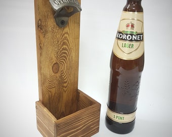 Wall mounted bottle opener with cap catcher.