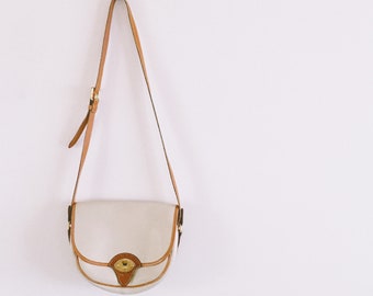 Dooney and Bourke All Weather Leather white and brown saddle bag handbag