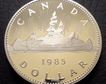 Beautiful,DCAM Canada,1985 1 Dollar~ Elizabeth II ~ Voyageur Canoe ~ Nice Detail & Proof Luster~Free US shipping!!