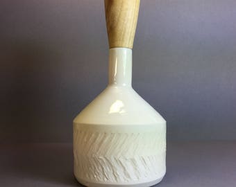 Handmade textured porcelain bottle with turned wooden top