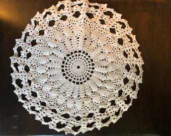 Ivory crocheted doily 11 inches in diameter