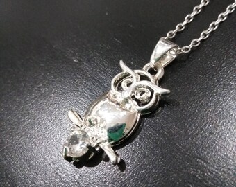 Silver owl holding a diamond on a sterling silver necklace