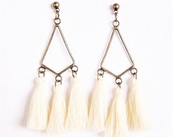 White tassel and chandelier earrings