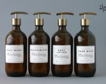 Amber glass bottle soap dispenser with metal pump and designer decal