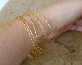 Hand crafted thin bangle bracelets in gold, gold bangle bracelets