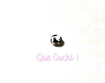 White ceramic bead with black spots hand painted by the Peruvians.