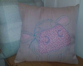 Lovely cow cushion in pink with floral touches.