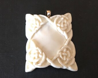 Carved Bone Pendant with Sterling Silver Bail