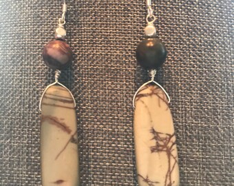Neutral and classy--drop earrings featuring topaz centers and glass beads