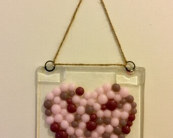 Fused glass heart hanging decoration.