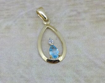 10KT Yellow Gold .22 Blue Topaz and .005 Diamond Pendant