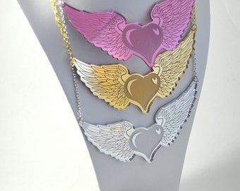 FREE HEART - Winged Heart Chest Piece Tattoo Style Charm Necklace - Laser Cut Acrylic In Gold, Silver, and Pink Mirror