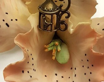 Necklace with metal cage pendant