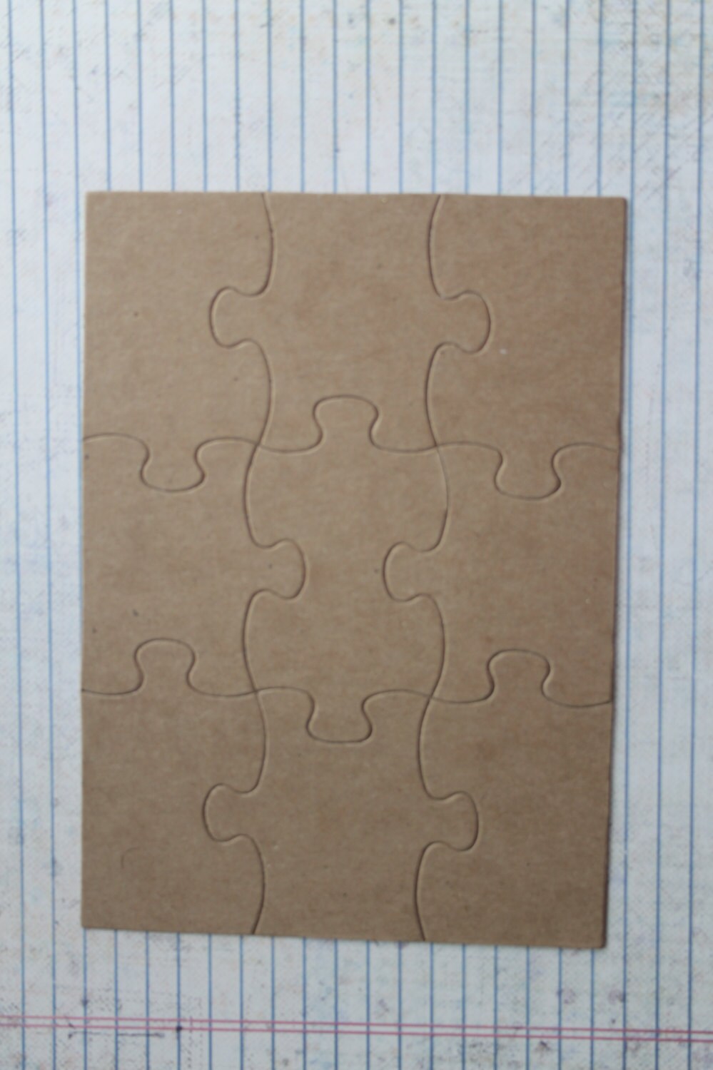 9 piece 5 x7 inch jigsaw puzzle Bare chipboard die cuts each