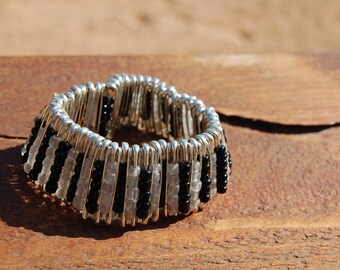 black and white bracelet made with safety pins hand