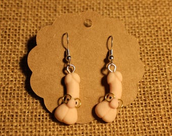 White penis earrings with glasses