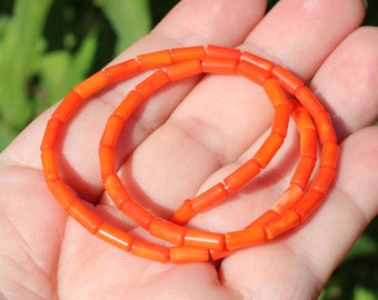 4 BEADS ORANGE CORAL TUBE 7 X 3 MM.