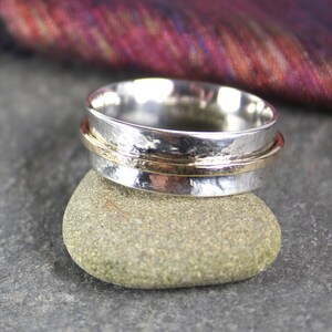 silver and gold spinner ring