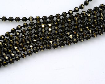 Faceted gold tone and black Brass Chain diameter 2 mm