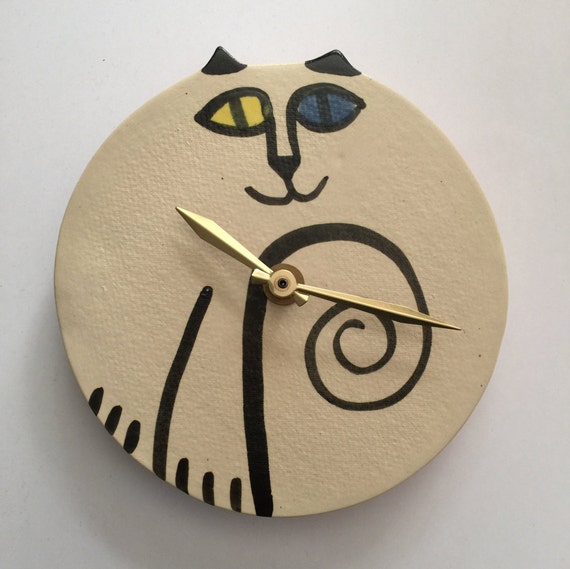 wall clock: cat round odd eyed white black ceramic hand made wall clock: cat round odd eyed white black ceramic hand made
