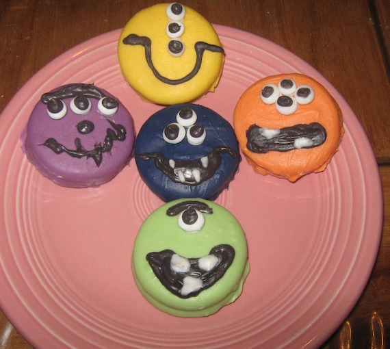 One dozen alien funny face chocolate covered sandwich cookies