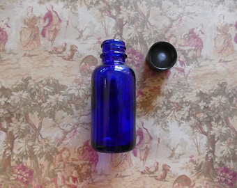cobalt blue boston round glass bottle with cap 1 oz.