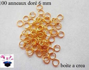 100 6 mm, gold simple open hoops.