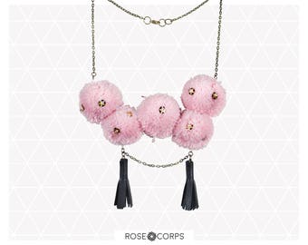 Short pom pom necklace with faux leather tassels