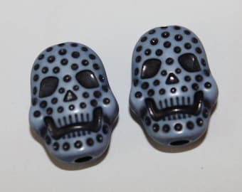 Skull double-sided, blue, 15 * 20 mm, the pair