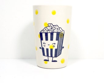 itty bitty cylinder with yellow polkadots and a happy popcorn guy, made to order.