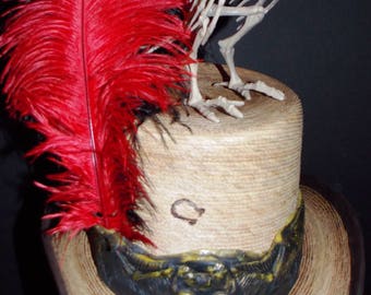 Boney Bird Top Hat.Gothic hat band and a leather-brass hat band under the gothic.red-black feathers.plastic bird,one of a kind,size large.