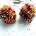 2 Multi colored pom pom hair ties