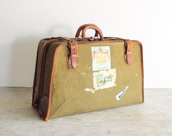 vintage suitcase, luggage, old luggage, world traveler canvas & leather garment bag w/travel stickers, timeworn character, 1940s, vintage
