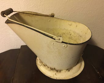 Old bucket wood handle-planter-yard item. Vintage bucket-storage-rustic-flower arrangement.