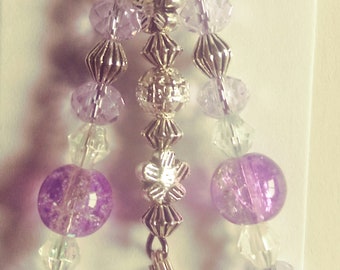Purple zipper pull with genie bottle charm