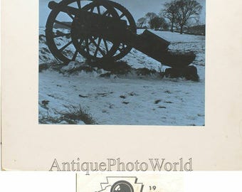 Cannon gun in winter field tinted vintage art photo