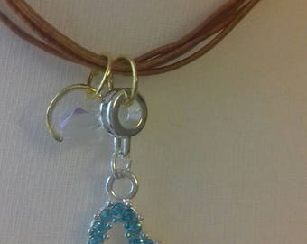 Charm necklace with crystals and turquoise heart shape