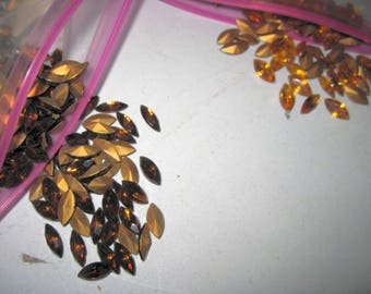 Huge lot of vintage rootbeer and amber colored cabachon rhinestones