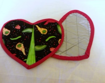 Heart shaped potholders with peppers