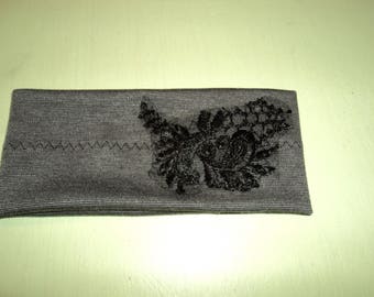 Black jersey decorated with lace flower girl headband