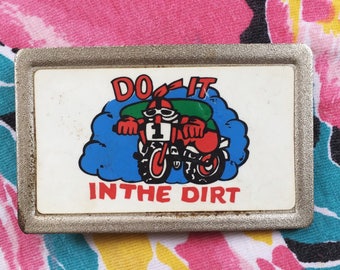 Do it in the dirt- Badass Belt Buckle- belt buckle- sturdy- unknown material- 1970s- 1980s- vintage